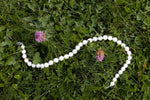 Collier de grosses perles blanches